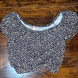 Crop/off the shoulder shirt.